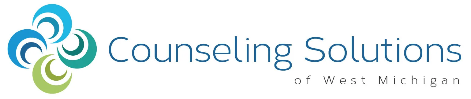 Counseling Solutions of West Michigan logo with blue and green spiral design